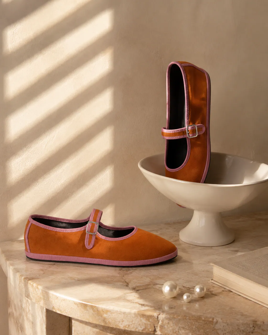 A BIBA Caramello slipper in a sculptural, sunlit interior